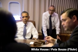 FILE - President Barack Obama holds a meeting with National Security Advisor Susan E. Rice, John Podesta, Counselor to the President and Phil Reiner, Senior Director for South Asian Affairs, aboard Air Force One.