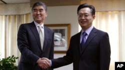 FILE - Hwang Joon-kook, right, South Korea's special representative for Korean Peninsula affairs — shown in Seoul last year with U.S. Special Representative for North Korea Policy Sung Kim — says exploratory talks will test Pyongyang’s will to denuclearize.