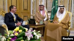 U.S. Defense Secretary Ash Carter meets with Saudi Arabia's King Salman bin Abdul Aziz, right, at Al-Salam Palace in Jeddah, Saudi Arabia, July 22, 2015. 