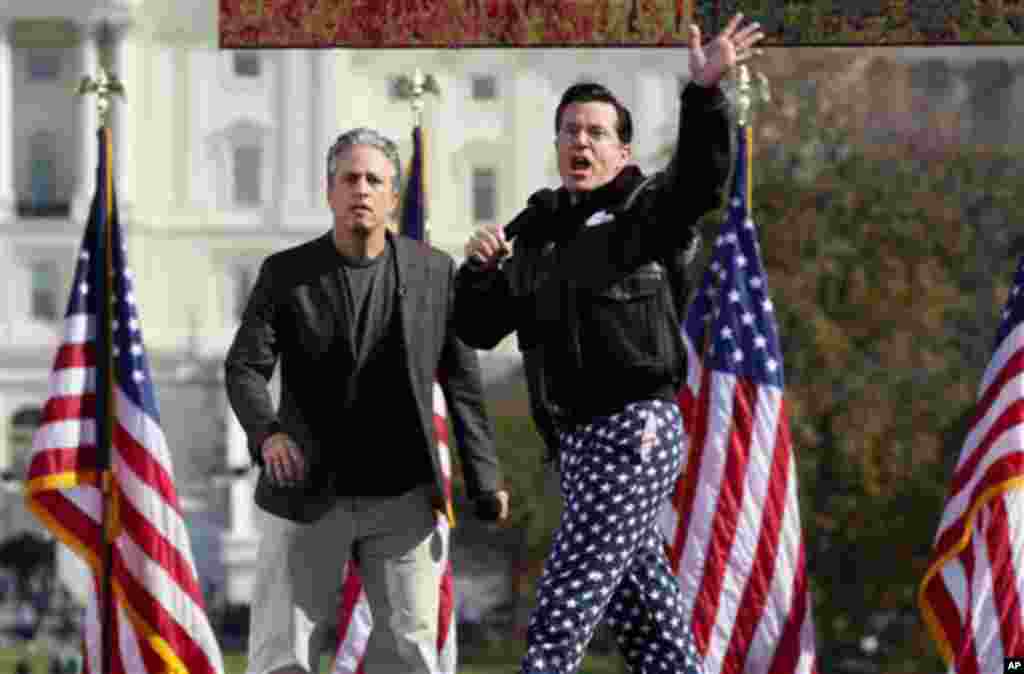 Comedians Stephen Colbert, right, and Jon Stewart perform in front of the U.S. Capitol during their Rally to Restore Sanity and/or Fear on the National Mall in Washington, Saturday, Oct. 30, 2010. The "sanity" rally blending laughs and political activism 