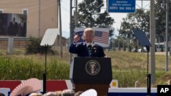 U.S. Vice President Joe Biden gives an address during a ceremony to name the national road after his late son Joseph R. "Beau" Biden III, in the village of Sojevo, Kosovo, Aug. 17, 2016. 