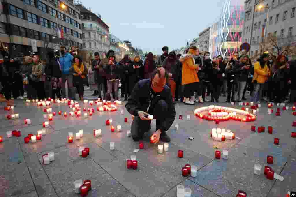 People light candles during the celebrations of the 31st anniversary of the pro-democratic Velvet Revolution that ended communist rule in 1989, in Prague, Czech Republic.