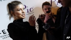 Singer Fergie arrives at a premiere screening of her new visual album "Double Dutchess: Seeing Double" visual album at iPic Theaters Fulton Market, Sept. 20, 2017, in New York. 