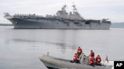 U.S. Navy ship USS Essex, in the back, arrives at the former U.S. naval base in Subic, northern Philippines (2003 file photo)