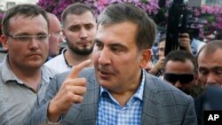 Georgia's ex-President Mikheil Saakashvili gestures as he speaks to reporters upon his arrival at Boryspil Airport, outside Kyiv, Ukraine, May 29, 2019. 