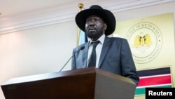 South Sudan President Salva Kiir, shown here at a news conference in Juba, says a key word was changed in the Arusha agreement to reunify the Sudan People's Liberation Movement, which fractured when violence erupted in Dec. 2013.