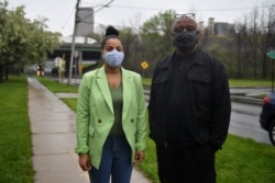 Lanessa Owens-Chaplin, lawyer, and David Rufus, I-81 Project Coordinator, New York Civil Liberties Union pose next to the I-81 freeway in Syracuse, New York, U.S., April 28, 2021.