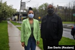 Lanessa Owens-Chaplin, lawyer, and David Rufus, I-81 Project Coordinator, New York Civil Liberties Union pose next to the I-81 freeway in Syracuse, New York, U.S., April 28, 2021.