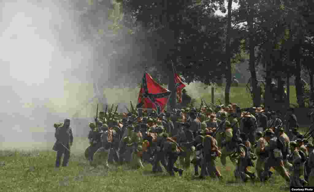 Confederates charge Union lines during a reenactment of the battle at Antietam. (© Kenneth Garrett Photography)