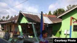 Beberapa rumah warga tampak roboh pasca gempa di Palu, Sulawesi Tengah, Jumat sore 28/9 (Courtesy: BNPB).