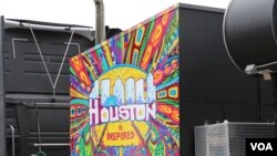 Food trucks are everywhere at the Super Bowl Live fan festival in downtown Houston, some sporting colorful murals and decorations. (B. Allen/VOA)