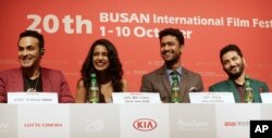 From left, Indian director Mozez Singh, actress Sarah Jane Dias, actor Vicky Kaushal and actor Raaghav Chanana smile during a press conference for the Busan International Film Festival opening movie " Zubaan" in Busan, South Korea, Oct.1, 2015.
