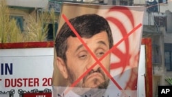 A poster protesting the upcoming visit to Lebanon by Iranian President Mahmoud Ahmadinejad at a street advertising billboard, with words reading:" Rule of the clergy not welcome in Lebanon," Tripoli, 07 Oct 2010