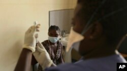 Virus Outbreak Zimbabwe Vaccines Mandate