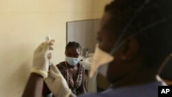 Virus Outbreak Zimbabwe Vaccines Mandate