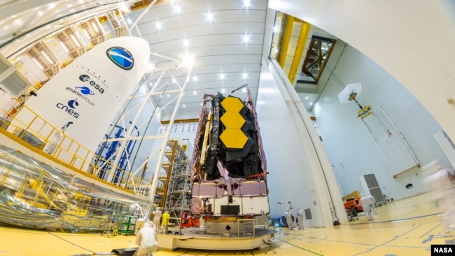 This file photo, taken on December 11, NASA’s James Webb Space Telescope was secured on top of the Ariane 5 rocket that will launch it to space from Europe’s Spaceport in French Guiana. (Image credit: ESA-M.Pedoussaut)