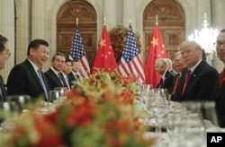 FILE - President Donald Trump meets with China's President Xi Jinping during their bilateral meeting at the G-20 summit in Buenos Aires, Argentina, Dec. 1, 2018.