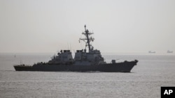 FILE - The USS Donald Cook sails through the Bosporus near Istanbul, Turkey. On April 11 and 12 Russian jets flew similated attacks near the vessel in international waters near the coast of Russia's Kaliningrad enclave between Poland and Lithuania.