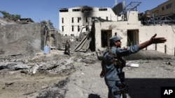 Afghan security forces inspect at the site of suicide attack in Kabul, Afghanistan, Sept. 6, 2016. 