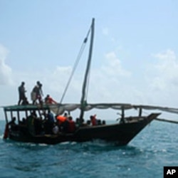 A Zanzibar fishing vessel carries the survivors of the ferry crash ashore, Tanzania, September 10, 2011.