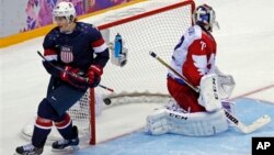 USA forward T.J. Oshie scores in shootout against Russia during men's ice hockey matchup at the 2014 Winter Olympics, Sochi, Feb. 15, 2014.