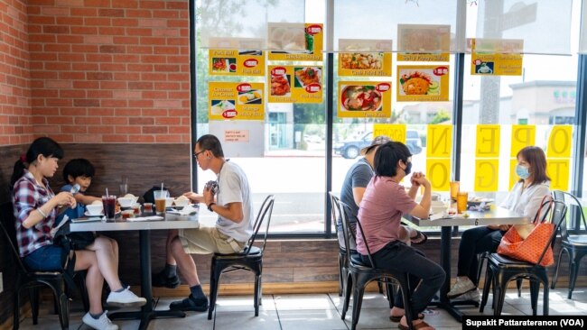 People eat at the Red Chicken Thai restaurant as Los Angeles County moves into life up restrictive coronavirus disease (COVID-19) disease reopening tier, in San Gabriel Valley, California, U.S., June 15, 2021