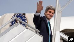 U.S. Secretary of State John Kerry leaves Paris, March 31, 2014, for a trip to the Middle East to work on talks about the Middle East peace process. 