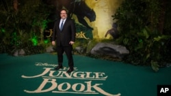 Director Jon Favreau poses for photographers upon arrival at the European premiere of the film "The Jungle Book" in London, April 13, 2016. 