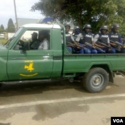 Police in a truck at the venue of the protest just outside the Harare central business district