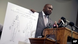 The Brown family's attorney Daryl Parks speaks during a news conference to share preliminary results of a second autopsy done on 18-year-old Michael Brown, in St. Louis County, Missouri, Aug. 18, 2014.