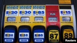 FILE - A gas pump displays the price for E15, a gasoline with 15 percent of ethanol, and various other ethanol blends at a gas station in Nevada, Iowa, May 17, 2015.