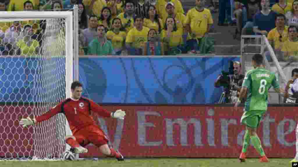 A kick by Nigeria's Peter Odemwingie goes under Bosnia's goalkeeper Asmir Begovic to score Nigeria's first goal.