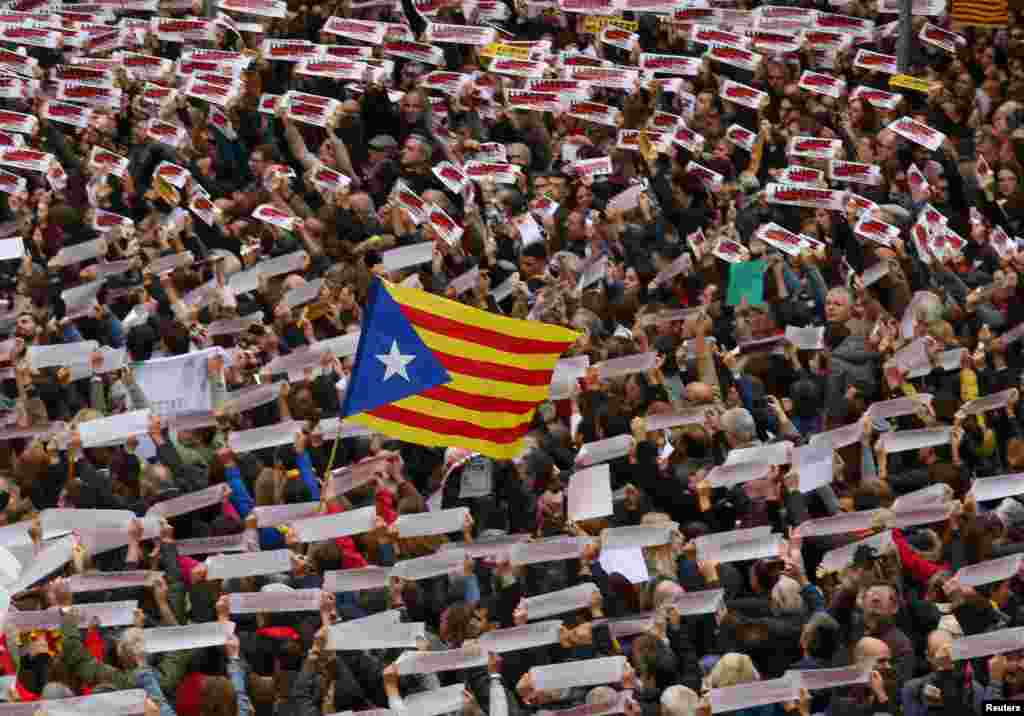 Protesters hold banners reading &quot;Freedom Political Prisoners, We are Republic&quot; as they gather in Sant Jaume square at a demonstration during a partial regional strike in Barcelona, Spain.