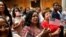 New citizens stand during a U.S. Citizenship and Immigration Services (USCIS) naturalization ceremony at the New York Public Library in Manhattan, New York, July 3, 2018. 