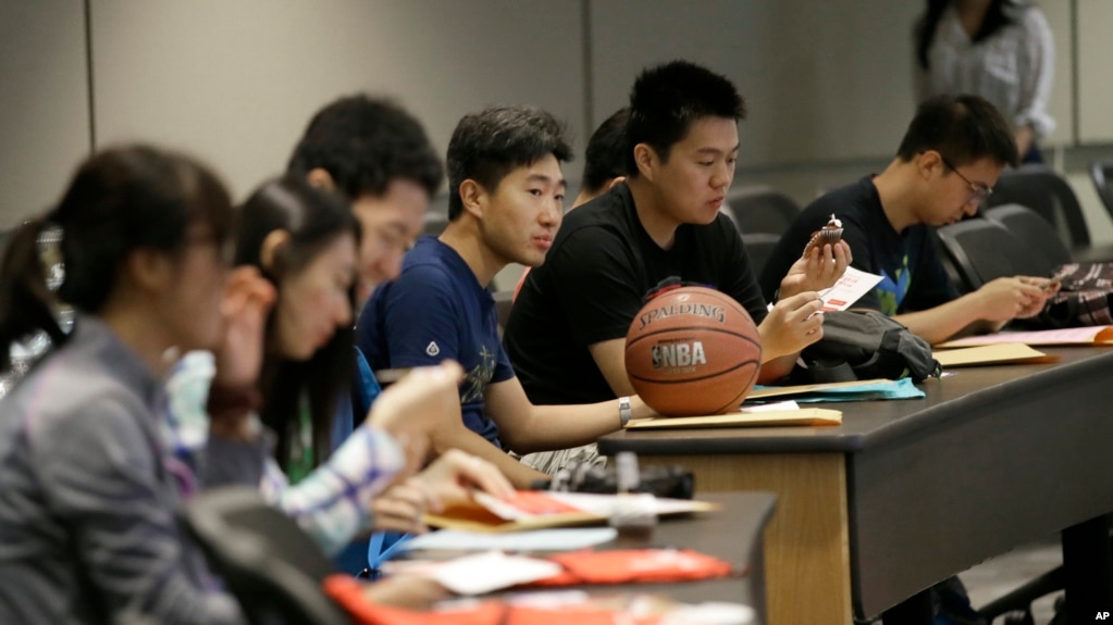 FILE - Weikang Nie, a finance graduate student from China, attends a new student orientation at the University of Texas at Dallas in Richardson, Texas Aug. 22, 2015. (AP Photo/LM Otero)