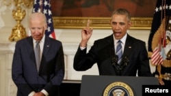 U.S. President Barack Obama delivers remarks at a tribute to Joe Biden in the State Dining Room of the White House, Jan. 12, 2017. Obama later surprised Biden by presenting the vice president the Presidential Medal of Freedom.