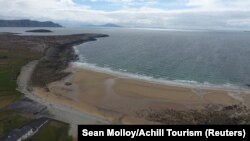 A wide view of Dooagh beach after a storm returned sand to it, 30 years after another storm had stripped all the sand off the beach, on Achill island, County Mayo, Ireland, May 5, 2017. 