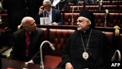 Members of the Egyptian constitutional panel prepare to vote on the new constitution at the Shura council in downtown Cairo, Nov. 30, 2013. 