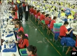 FILE - In this file image from undated video footage run by China's CCTV via AP Video, Muslim trainees work in a garment factory at the Hotan Vocational Education and Training Center in Hotan, Xinjiang, northwest China. (CCTV via AP Video, File)