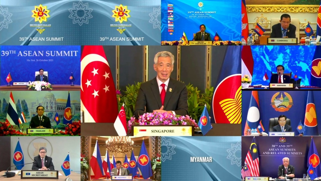 This handout photo released by the host broadcast, ASEAN Summit 2021, on October 26, 2021 shows Singapore's Prime Minister Lee Hsien Loong (C) taking part in the 39th Association of Southeast Asian Nations summit.
