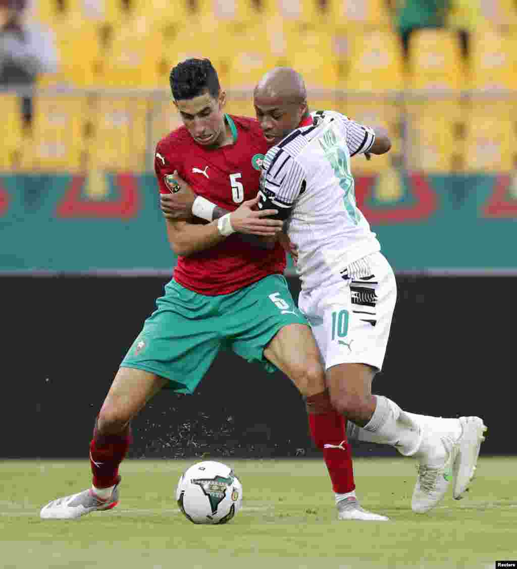 Ghana&#39;s Andre Ayew in action with Morocco&#39;s Nayef Aguerd.