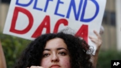 FILE - Loyola Marymount University student and Dreamer Maria Carolina Gomez joins a rally in support of the Deferred Action for Childhood Arrivals, program, outside the Edward Roybal Federal Building in Los Angeles, Sept. 1, 2017.