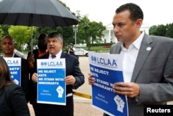 AFL-CIO President Richard Trumka, center, participates in a protest against President Donald Trump's decision to end DACA outside the White House in Washington, Sept. 6, 2017.