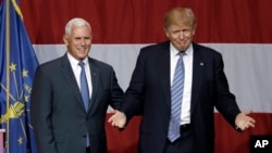 Indiana Gov. Mike Pence joins Republican presidential candidate Donald Trump at a rally in Westfield, Ind., July 12, 2016. U.S. media reports say Trump will announce on Friday that Pence is his running mate. 