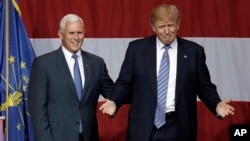 Indiana Gov. Mike Pence joins Republican presidential candidate Donald Trump at a rally in Westfield, Indiana, July 12, 2016.