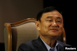 FILE - Former Thai Prime Minister Thaksin Shinawatra speaks to Reuters during an interview in Singapore, Feb. 23, 2016.