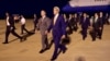 U.S. Ambassador to Cambodia William Heidt, center, escorts U.S. Secretary of State John Kerry, right, after he arrives at Phnom Pehn International Airport in Phnom Pehn, Cambodia, Jan. 25, 2016.