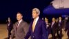 U.S. Ambassador to Cambodia William Heidt, center, escorts U.S. Secretary of State John Kerry, right, after he arrives at Phnom Pehn International Airport in Phnom Pehn, Cambodia, Jan. 25, 2016.