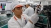 A manufacturer works at an assembly line of Vingroup's Vsmart phone in Hai Phong, Vietnam, Dec. 4, 2018.