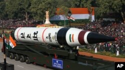 FILE - The long range ballistic Agni-V missile is displayed during Republic Day parade, in New Delhi, India , Jan. 26, 2013. 